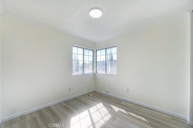 14 Fernwood Ct, Pittsburg, CA 94565 - unfurnished room featuring crown molding, light wood-style flooring, and baseboards