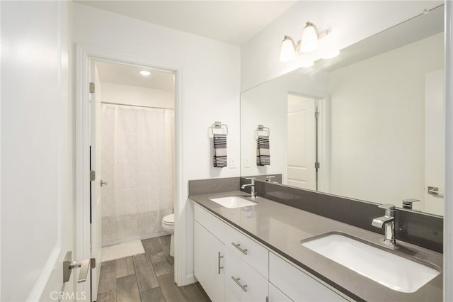 3611 Highclere Way, Clovis, CA 93619 - full bathroom with toilet, double vanity, wood finished floors, and curtained shower