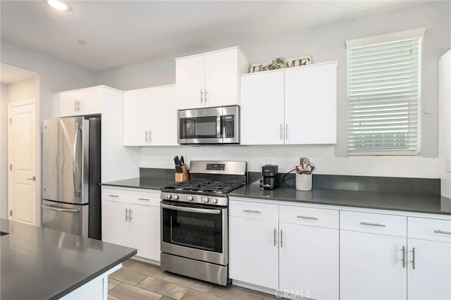 3611 Highclere Way, Clovis, CA 93619 - kitchen with appliances with stainless steel finishes, dark countertops, white cabinets, and recessed lighting