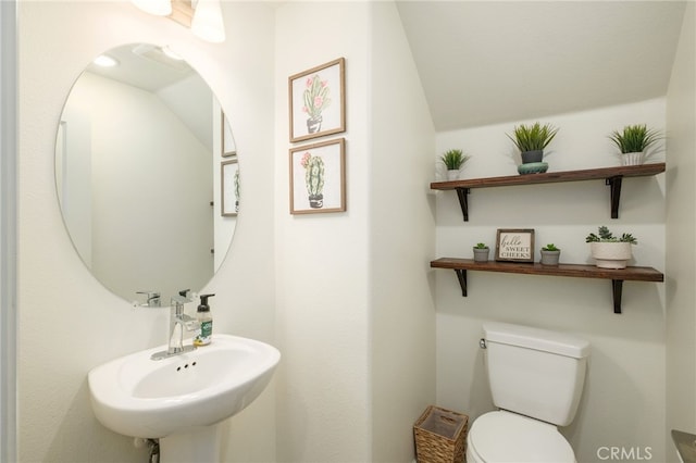 3611 Highclere Way, Clovis, CA 93619 - bathroom with toilet, vaulted ceiling, and a sink