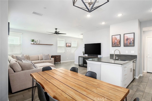 3611 Highclere Way, Clovis, CA 93619 - dining room featuring wood finished floors, plenty of natural light, baseboards, ceiling fan, and recessed lighting