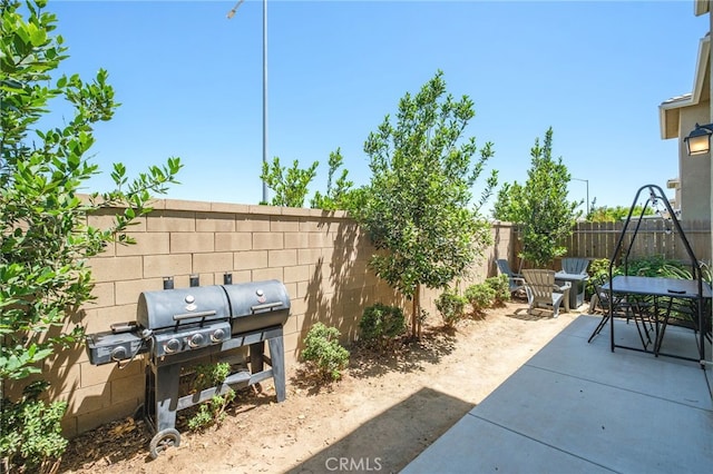 3611 Highclere Way, Clovis, CA 93619 - fenced backyard featuring grilling area, a patio area, and outdoor dining space