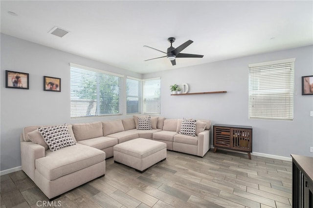 3611 Highclere Way, Clovis, CA 93619 - living room featuring light wood-style floors, a ceiling fan, and baseboards