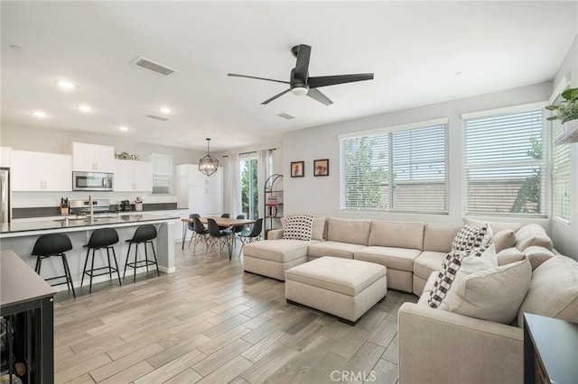 3611 Highclere Way, Clovis, CA 93619 - living area with ceiling fan, light wood-type flooring, and recessed lighting
