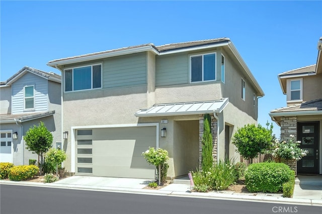 3611 Highclere Way, Clovis, CA 93619 - view of front of property featuring stucco siding, a garage, a standing seam roof, concrete driveway, and metal roof