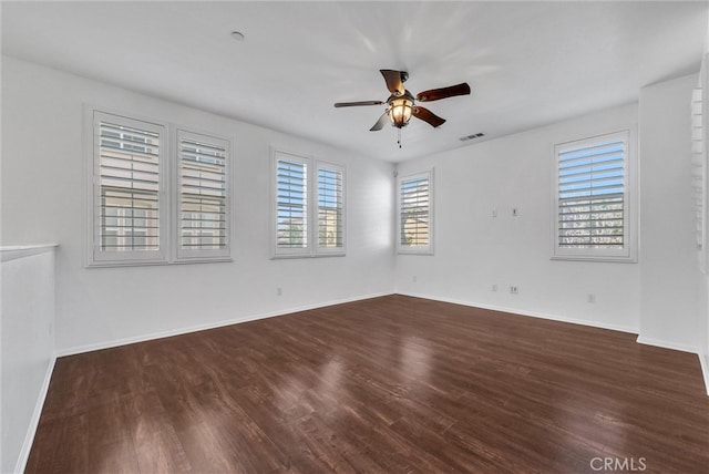 12473 Constellation St, Eastvale, CA 91752 - empty room featuring dark wood-style flooring, ceiling fan, and baseboards