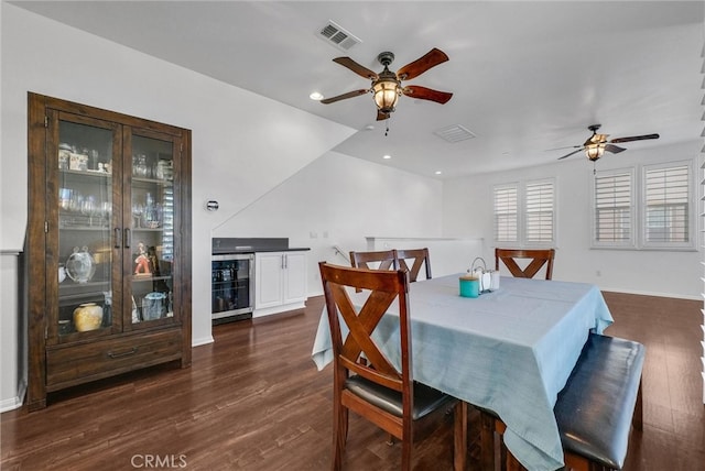 12473 Constellation St, Eastvale, CA 91752 - dining room with ceiling fan, beverage cooler, dark wood finished floors, baseboards, and recessed lighting