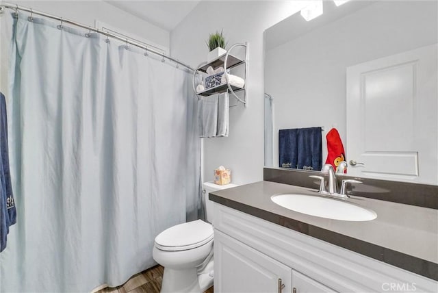 12473 Constellation St, Eastvale, CA 91752 - bathroom featuring vanity, toilet, wood finished floors, and a shower with shower curtain