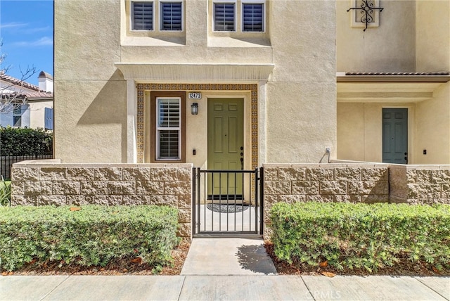12473 Constellation St, Eastvale, CA 91752 - property entrance featuring stucco siding and a gate