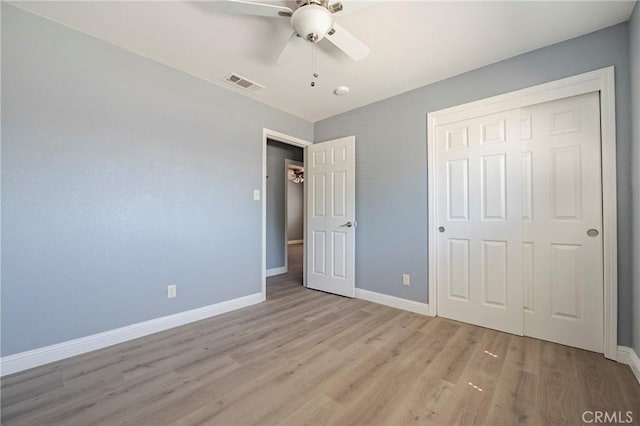 1615 Loughborough Dr, Merced, CA 95348 - unfurnished bedroom with baseboards, light wood-style flooring, a closet, and a ceiling fan