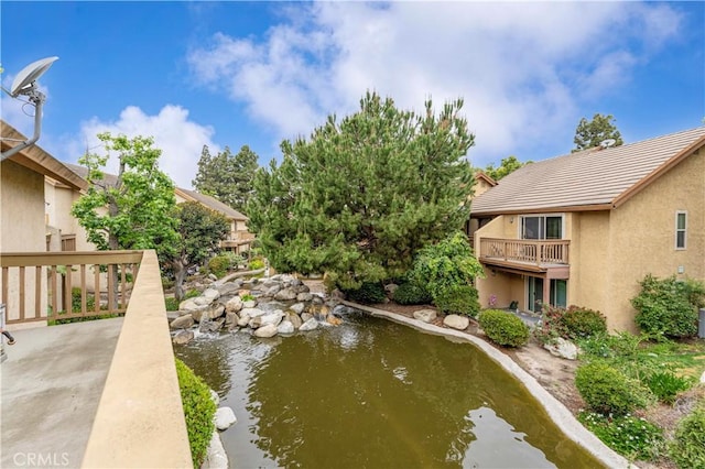 105 Tangelo Unit 400, Irvine, CA 92618 - view of home's community featuring a small pond
