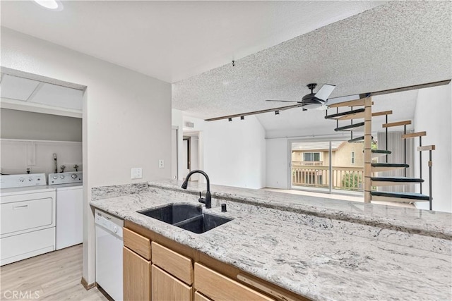 105 Tangelo Unit 400, Irvine, CA 92618 - kitchen featuring a sink, separate washer and dryer, dishwasher, a ceiling fan, and light wood-type flooring