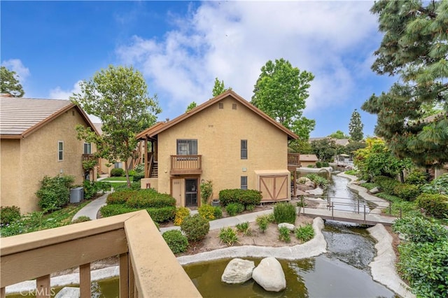 105 Tangelo Unit 400, Irvine, CA 92618 - back of property featuring a balcony and stucco siding