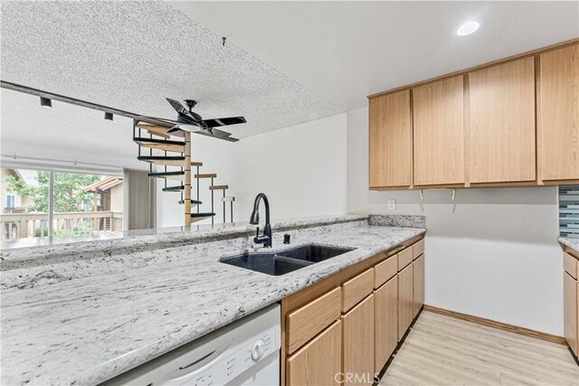 105 Tangelo Unit 400, Irvine, CA 92618 - kitchen featuring a sink, white dishwasher, light wood-style flooring, light stone counters, and light brown cabinets
