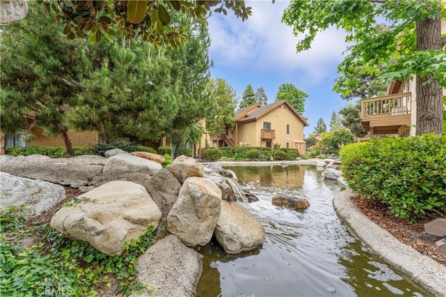 105 Tangelo Unit 400, Irvine, CA 92618 - view of home's community with a garden pond