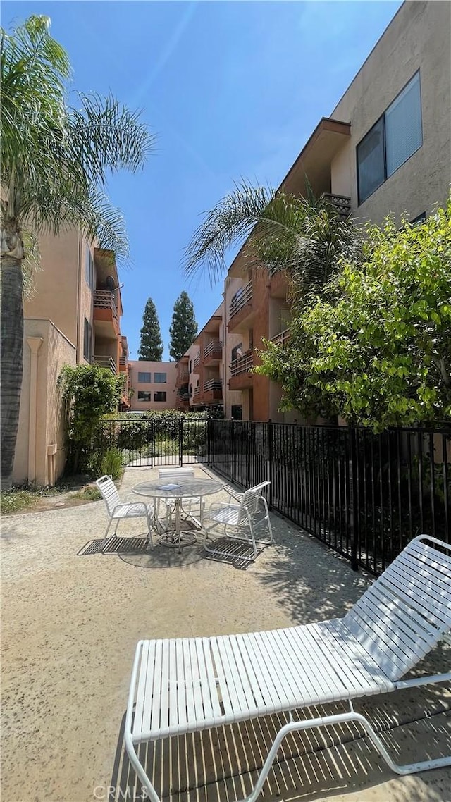 6815 Remmet Ave Unit 219, Canoga Park, CA 91303 - view of home's community with a patio area and outdoor dining area