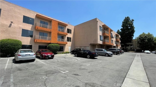 6815 Remmet Ave Unit 219, Canoga Park, CA 91303 - view of apartment building / complex with uncovered parking
