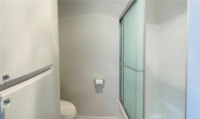 6815 Remmet Ave Unit 219, Canoga Park, CA 91303 - bathroom featuring a shower with shower door and toilet