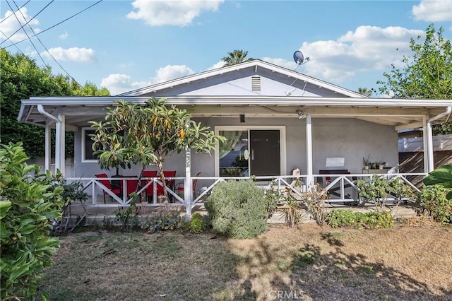 7117 Vanscoy Ave, North Hollywood, CA 91605 - view of front of home with stucco siding and a porch
