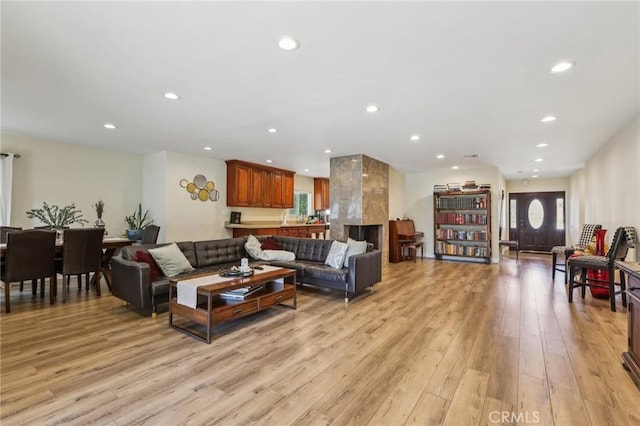 7117 Vanscoy Ave, North Hollywood, CA 91605 - living room featuring light wood-type flooring, recessed lighting, and a premium fireplace
