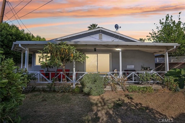 7117 Vanscoy Ave, North Hollywood, CA 91605 - rear view of property with a porch and stucco siding