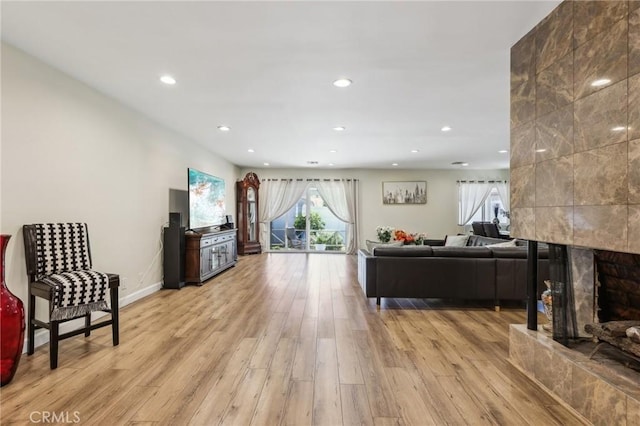 7117 Vanscoy Ave, North Hollywood, CA 91605 - living area with light wood-style flooring, recessed lighting, a fireplace, and baseboards