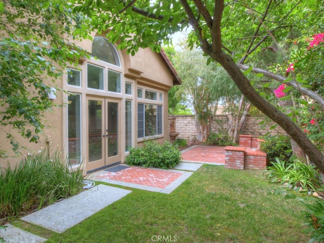 10655 Bruns Dr, Tustin, CA 92782 - view of yard with french doors and a patio
