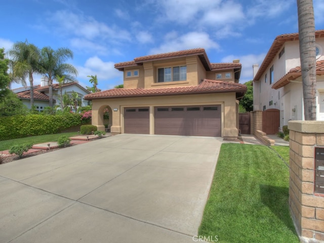 10655 Bruns Dr, Tustin, CA 92782 - mediterranean / spanish-style house with concrete driveway, a tile roof, a gate, stucco siding, and a garage