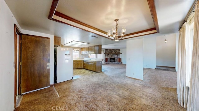 20061 Seneca Rd, Apple Valley, CA 92307 - kitchen featuring freestanding refrigerator, a raised ceiling, open floor plan, a chandelier, and light colored carpet
