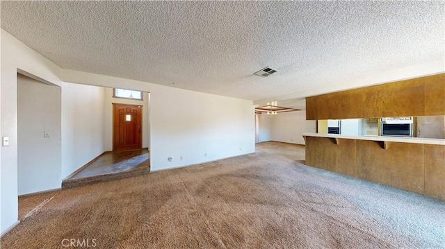 20061 Seneca Rd, Apple Valley, CA 92307 - unfurnished living room with light colored carpet and a textured ceiling