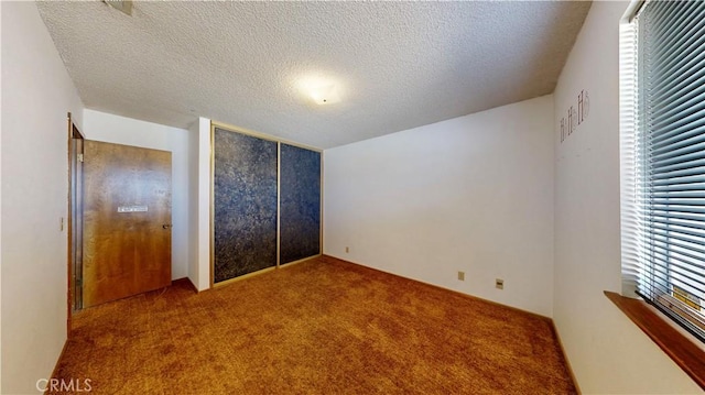 20061 Seneca Rd, Apple Valley, CA 92307 - unfurnished bedroom with carpet, a textured ceiling, and a closet