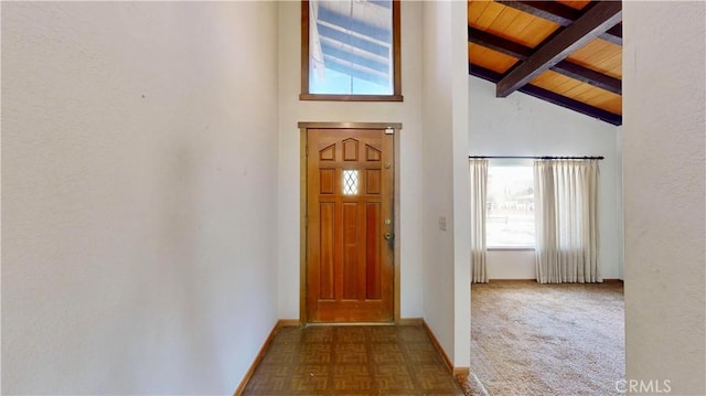 20061 Seneca Rd, Apple Valley, CA 92307 - foyer entrance with healthy amount of natural light, wood ceiling with exposed beams, high vaulted ceiling, and baseboards