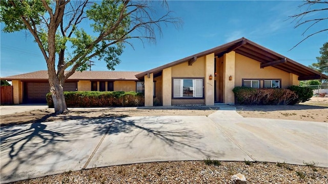 20061 Seneca Rd, Apple Valley, CA 92307 - view of front of home featuring an attached garage, stucco siding, and concrete driveway