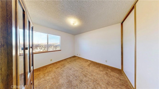 20061 Seneca Rd, Apple Valley, CA 92307 - unfurnished room with carpet floors and a textured ceiling