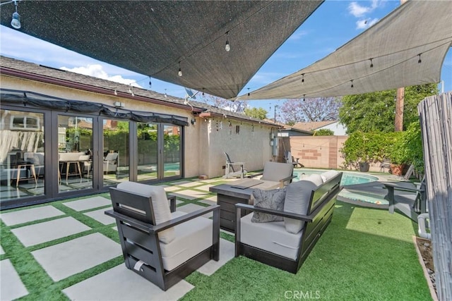 16302 Graystone Ave, Norwalk, CA 90650 - fenced backyard featuring a patio and an outdoor living space with a fire pit