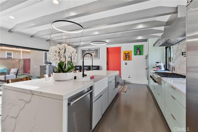 16302 Graystone Ave, Norwalk, CA 90650 - kitchen featuring stainless steel appliances, a sink, baseboards, a center island with sink, and wall chimney exhaust hood
