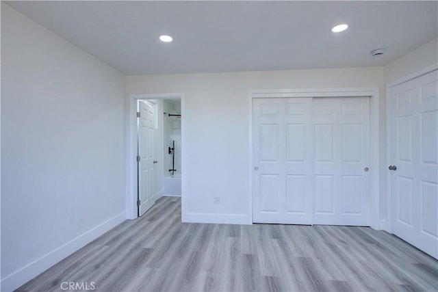 12337 W Main St, Turlock, CA 95380 - unfurnished bedroom with baseboards, light wood-style floors, a closet, recessed lighting, and ensuite bathroom