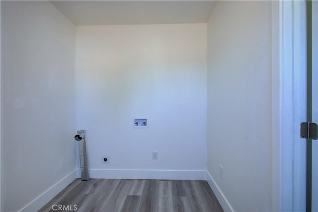 12337 W Main St, Turlock, CA 95380 - washroom featuring wood finished floors, hookup for a washing machine, baseboards, and hookup for an electric dryer
