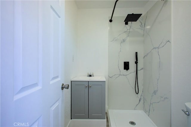 12337 W Main St, Turlock, CA 95380 - bathroom featuring a marble finish shower, vanity, and toilet