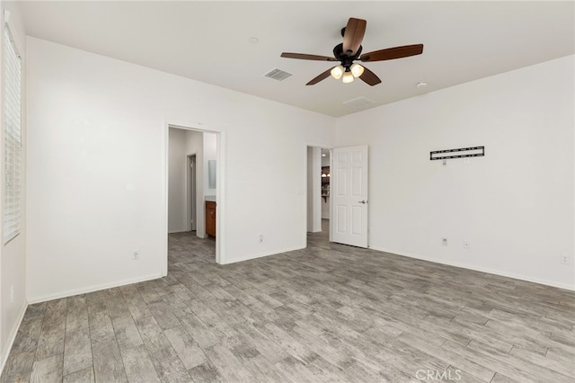 1536 Williamson, Beaumont, CA 92223 - unfurnished bedroom featuring light wood-style floors, baseboards, connected bathroom, and a ceiling fan