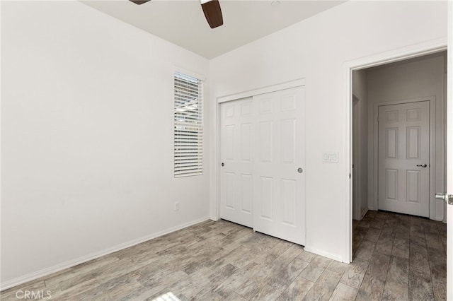 1536 Williamson, Beaumont, CA 92223 - unfurnished bedroom with wood finished floors, a closet, baseboards, and a ceiling fan