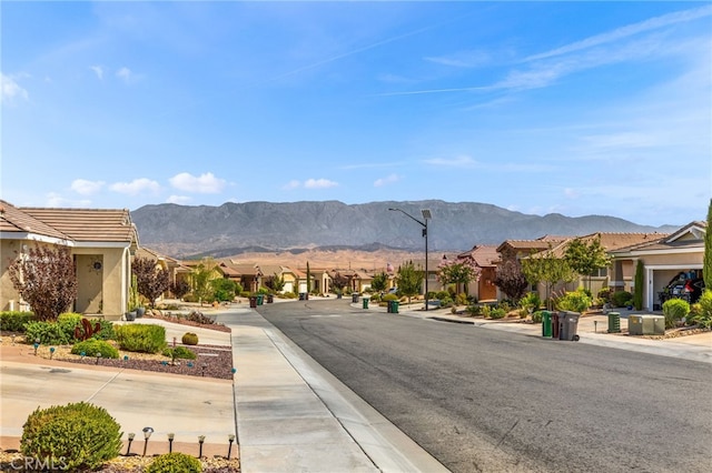 1536 Williamson, Beaumont, CA 92223 - view of asphalt road featuring sidewalks, street lights, curbs, and a mountain view