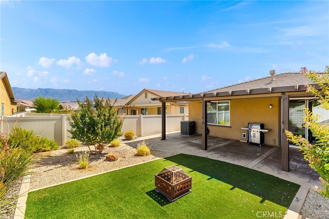 1536 Williamson, Beaumont, CA 92223 - view of yard with central AC unit, a patio, an outdoor fire pit, and a mountain view