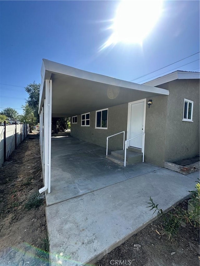 2480 Hall Ave, Jurupa Valley, CA 92509 - rear view of property featuring stucco siding and an attached carport
