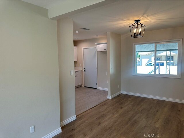 2480 Hall Ave, Jurupa Valley, CA 92509 - unfurnished room featuring wood finished floors, baseboards, recessed lighting, and a chandelier