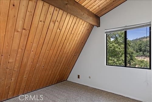 28921 Bear Valley Rd, Tehachapi, CA 93561 - carpeted spare room featuring wooden ceiling