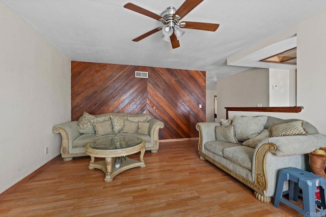 146 Padre Tullio Dr, San Ysidro, CA 92173 - living room with ceiling fan, wooden walls, and wood finished floors