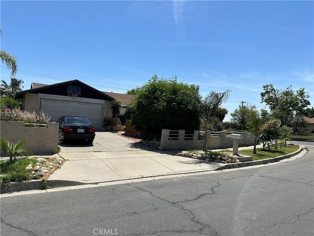 211 N Fillmore Ave, Rialto, CA 92376 - view of front facade with driveway and a garage
