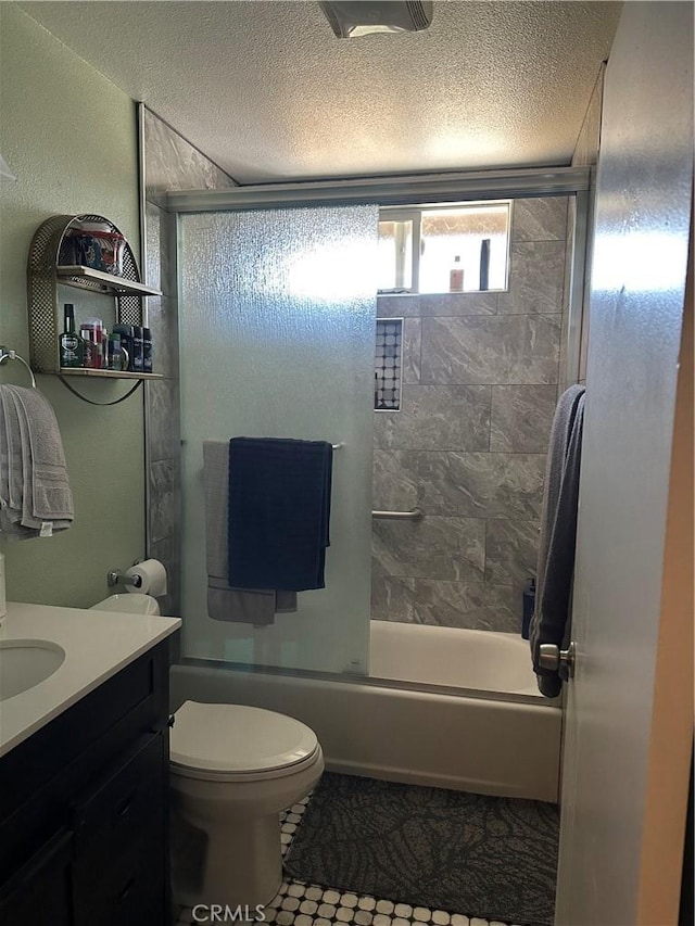 211 N Fillmore Ave, Rialto, CA 92376 - full bathroom featuring bath / shower combo with glass door, toilet, a textured ceiling, tile patterned floors, and vanity
