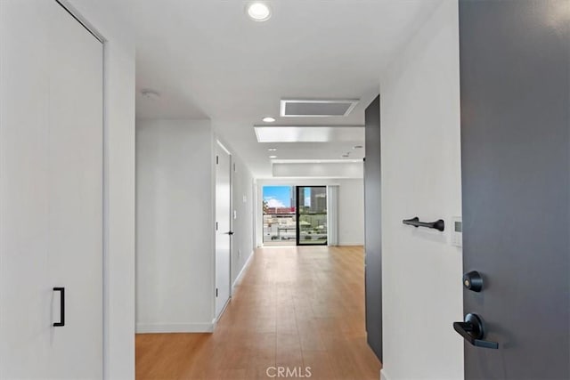 321 S Oxford Ave Unit 606, Los Angeles, CA 90020 - hallway featuring light wood-style floors, recessed lighting, baseboards, and attic access